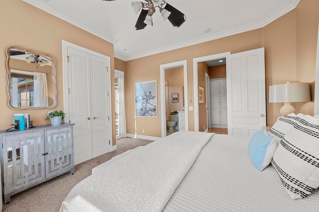 bedroom featuring light carpet, connected bathroom, ceiling fan, and ornamental molding