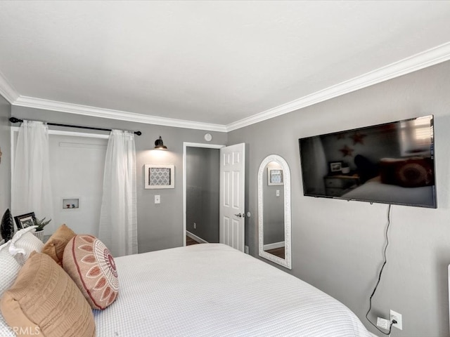 bedroom with ornamental molding