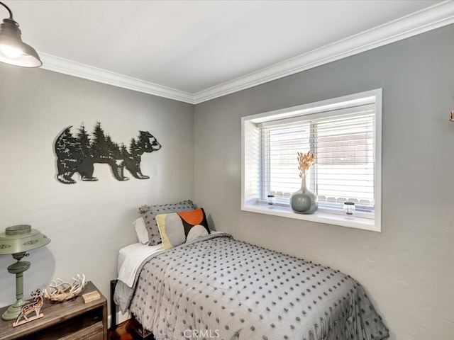 bedroom with crown molding