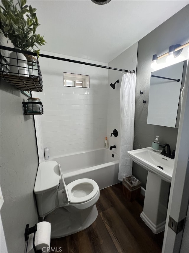 bathroom with shower / bath combination with curtain, toilet, and hardwood / wood-style flooring