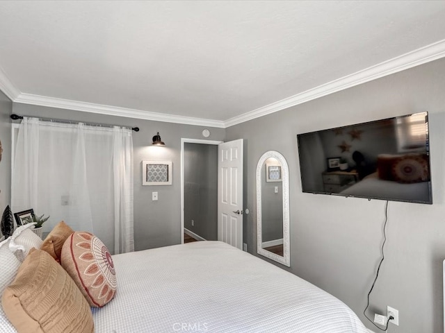 bedroom with crown molding