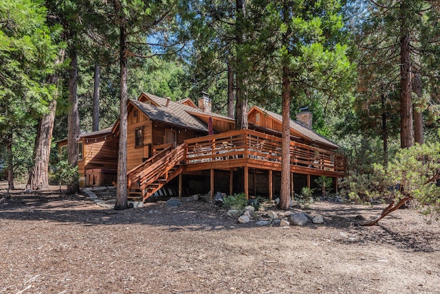 rear view of property with a wooden deck