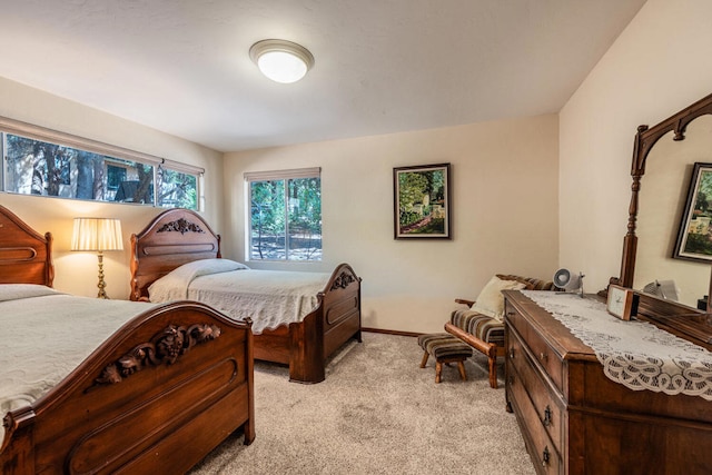 bedroom with light carpet