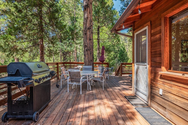 wooden deck featuring grilling area