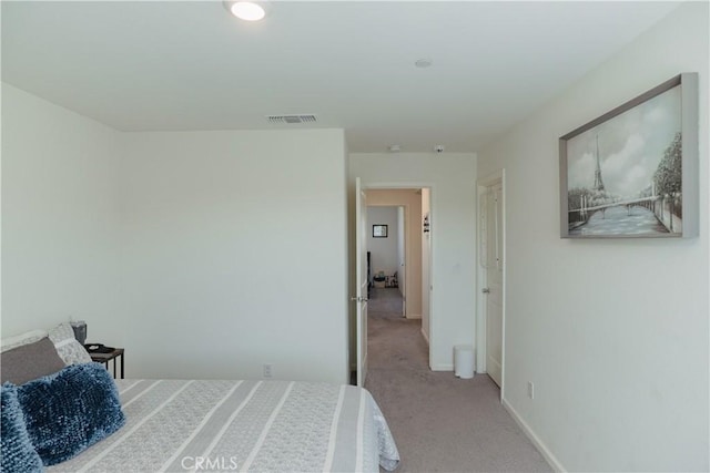 bedroom with light carpet