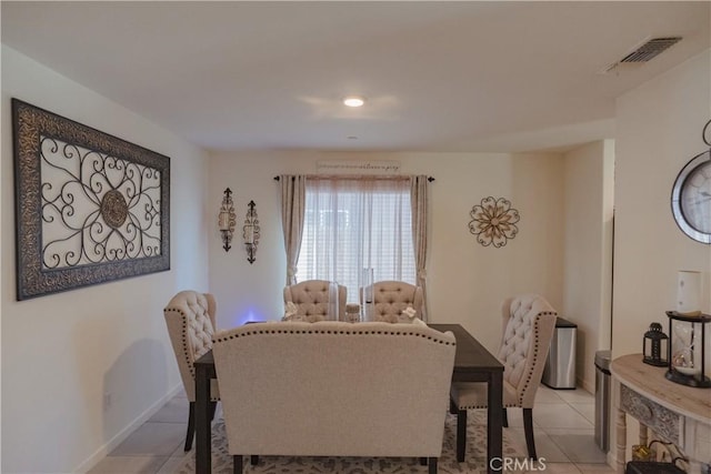 dining area with light tile patterned floors