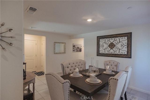 dining area featuring light tile patterned floors