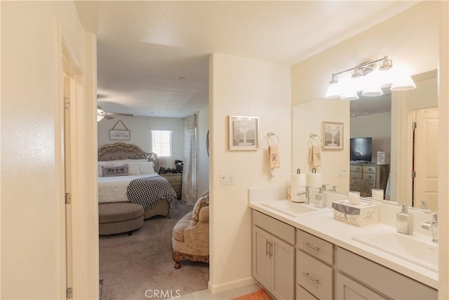 bathroom featuring ceiling fan and vanity