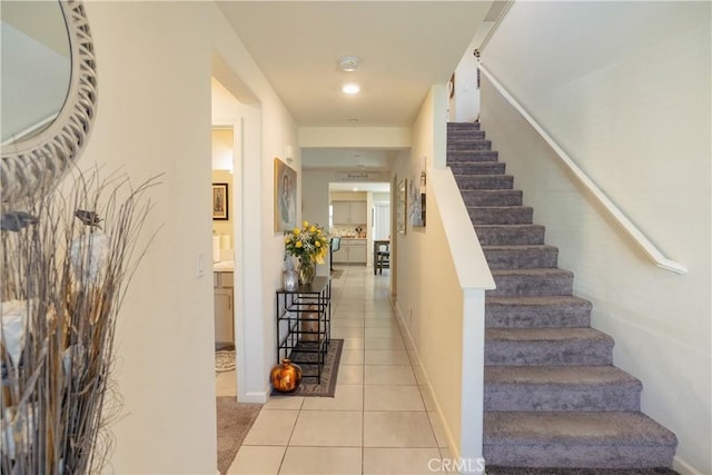 stairway featuring tile patterned floors