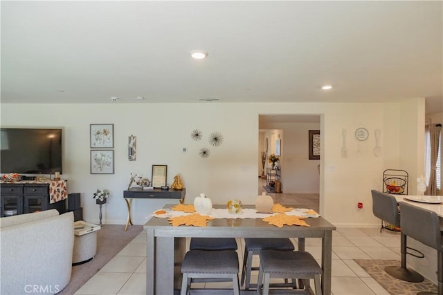 dining area featuring light tile patterned floors