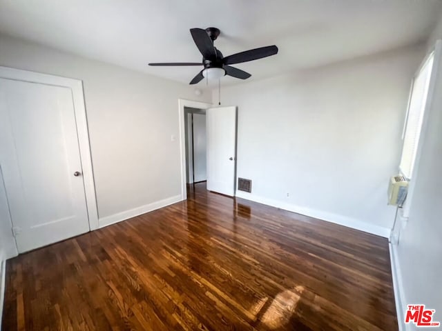 unfurnished bedroom featuring a closet, ceiling fan, and dark hardwood / wood-style floors