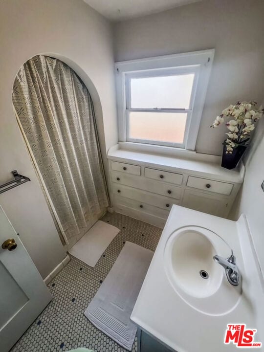 bathroom featuring vanity and tile patterned floors