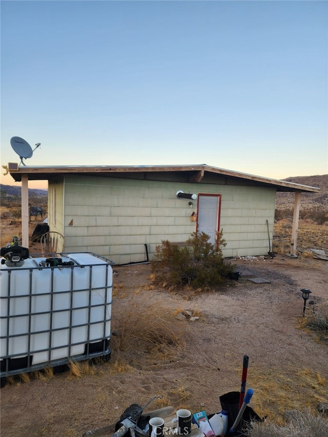 view of outdoor structure at dusk