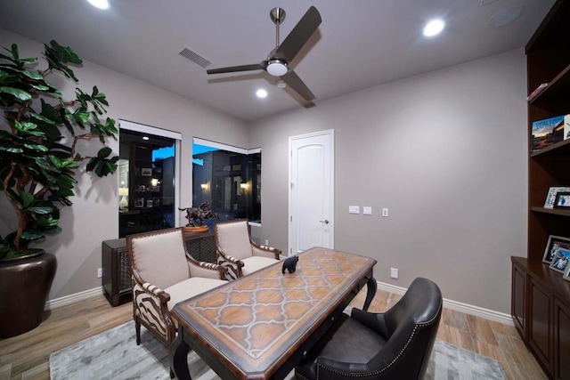 office area featuring light hardwood / wood-style flooring and ceiling fan