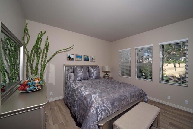 bedroom with light hardwood / wood-style flooring