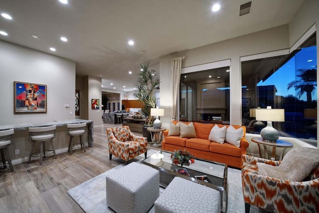 living room with light hardwood / wood-style flooring