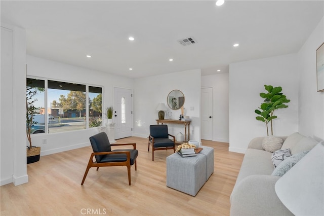 living room with light hardwood / wood-style floors