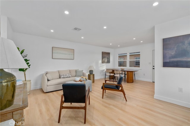 living room with light hardwood / wood-style floors