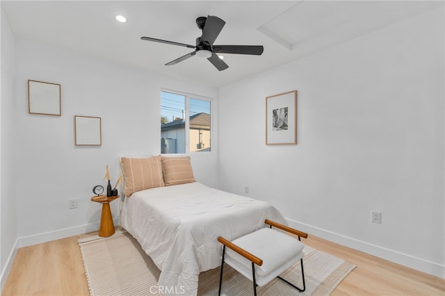 bedroom with ceiling fan and light wood-type flooring