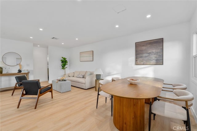 dining space with light wood-type flooring