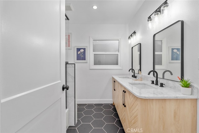 bathroom featuring tile patterned flooring and vanity