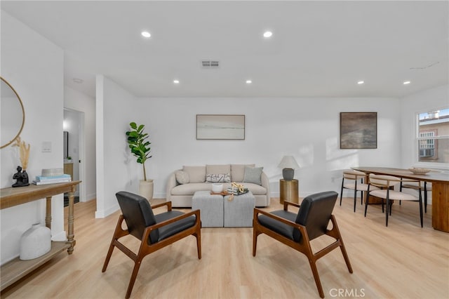 living room with light hardwood / wood-style flooring