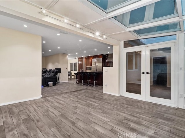 interior space featuring french doors and a wooden deck