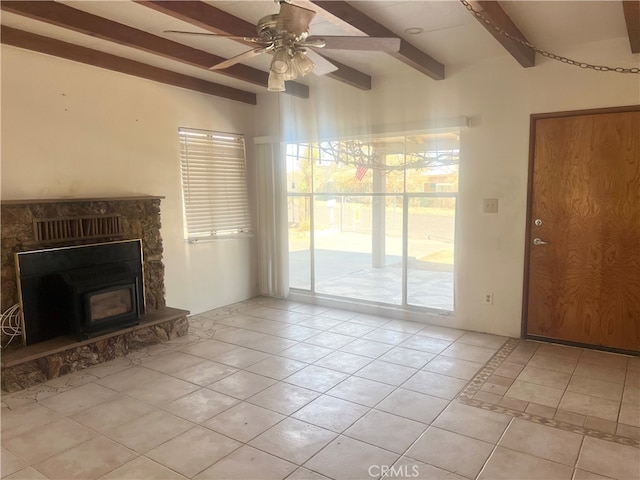 unfurnished living room featuring beam ceiling, light tile patterned floors, a fireplace, and ceiling fan