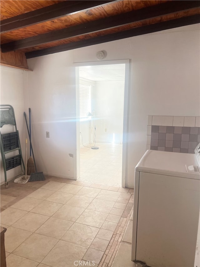 bathroom with wood ceiling, tile patterned floors, washer / clothes dryer, and beam ceiling