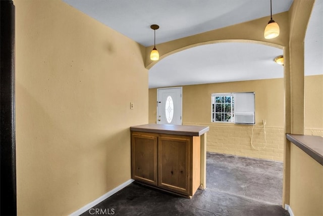 interior space with hanging light fixtures