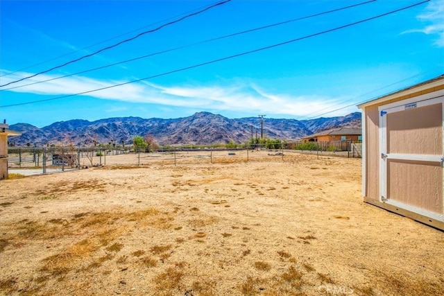 mountain view featuring a rural view