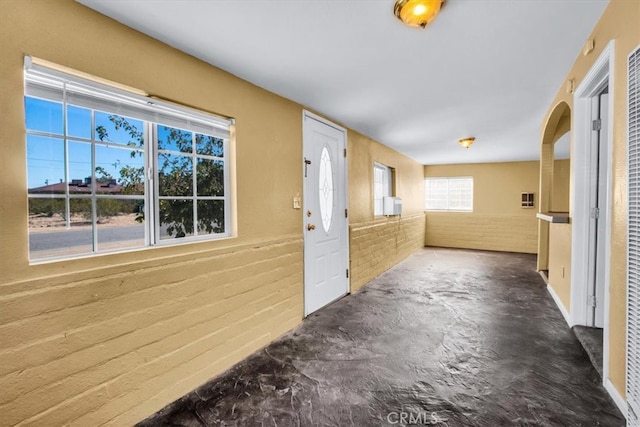 interior space featuring brick wall