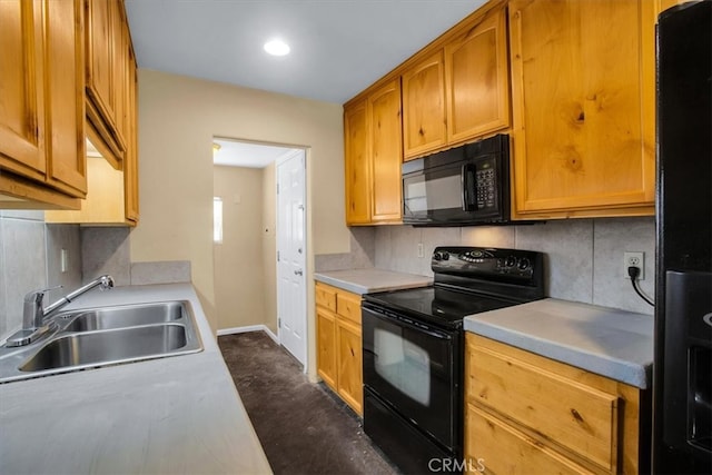 kitchen with sink, black appliances, and backsplash