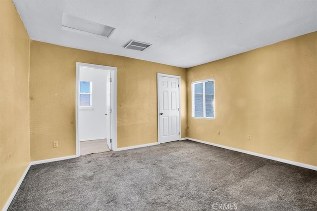 unfurnished room with carpet floors