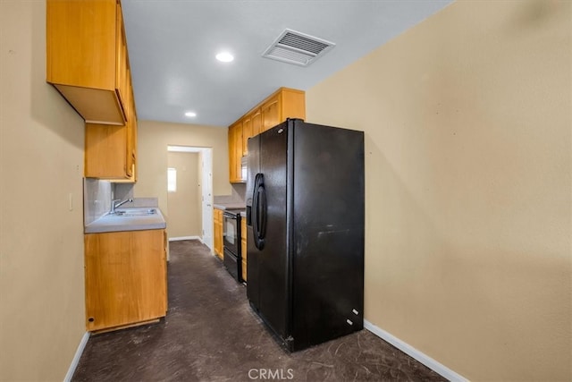 kitchen with black appliances and sink