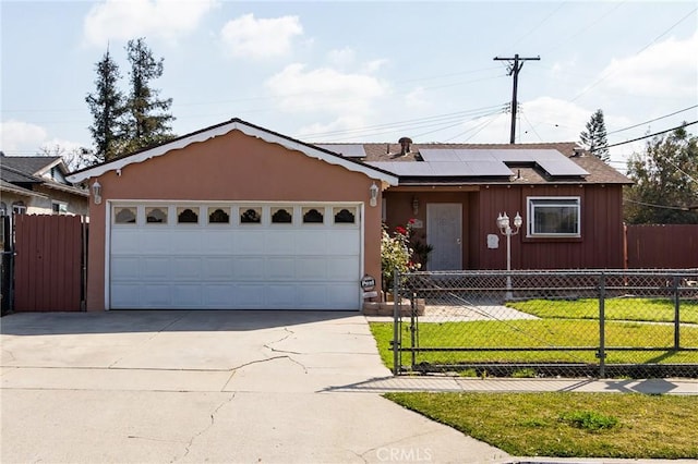 single story home with a garage, a front yard, and solar panels