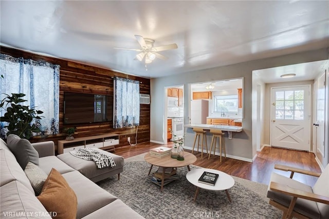 living room with hardwood / wood-style flooring and ceiling fan