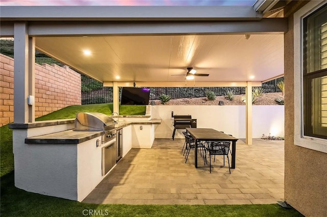 view of patio / terrace with ceiling fan and area for grilling