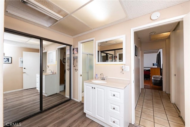 bathroom featuring hardwood / wood-style floors and vanity