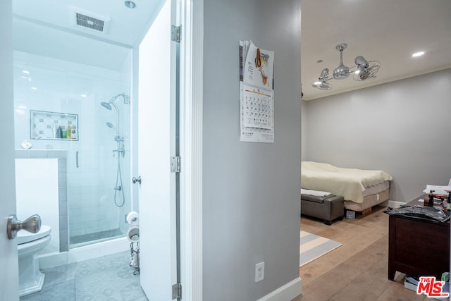 bathroom featuring a shower with door, toilet, wood-type flooring, and vanity