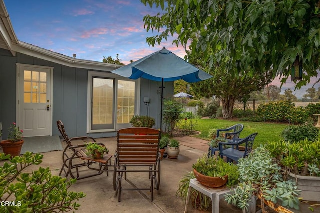 patio terrace at dusk with a lawn