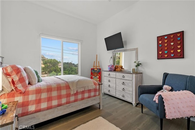 bedroom with dark wood-type flooring