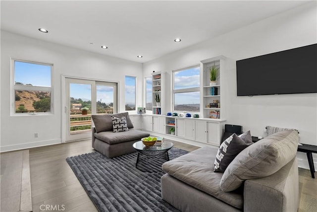 8350 Hillcroft Dr, West Hills, CA 91304 - living room featuring healthy amount of natural light, recessed lighting, light wood-style flooring, and baseboards