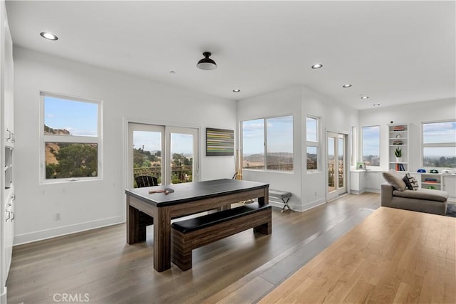 8350 Hillcroft Dr, West Hills, CA 91304 - dining room with recessed lighting, healthy amount of natural light, baseboards, light wood-style floors, and built in shelves