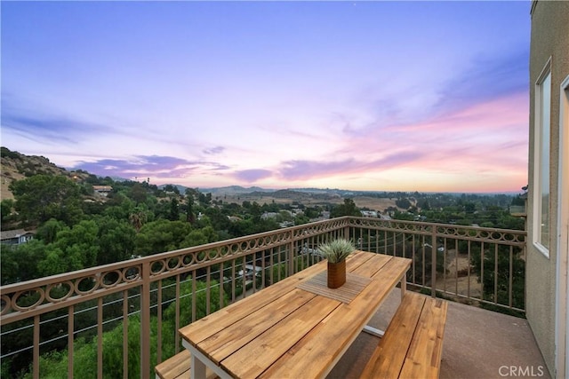 view of balcony at dusk