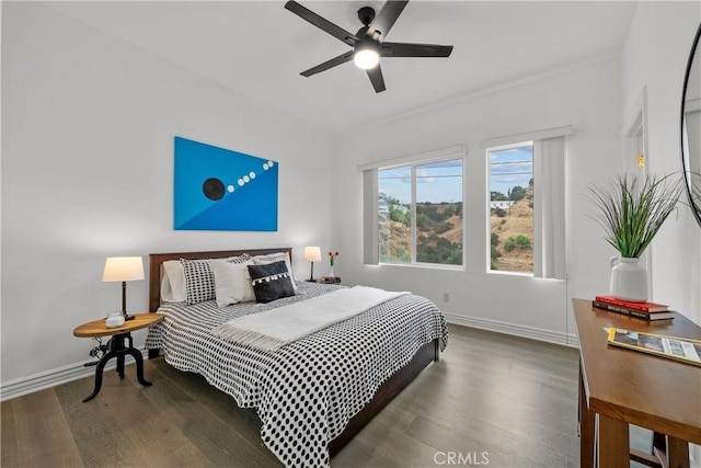 bedroom featuring dark hardwood / wood-style flooring and ceiling fan