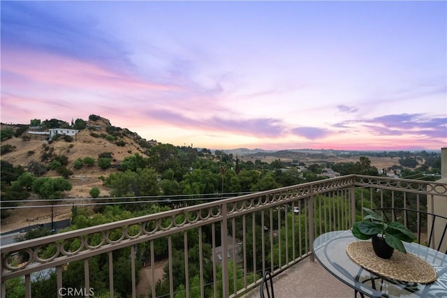 view of balcony at dusk