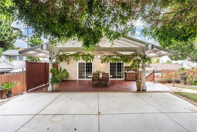 rear view of property featuring a patio