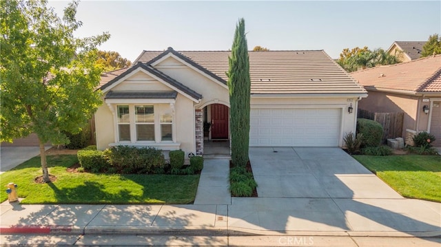 view of front of house featuring a front yard and a garage