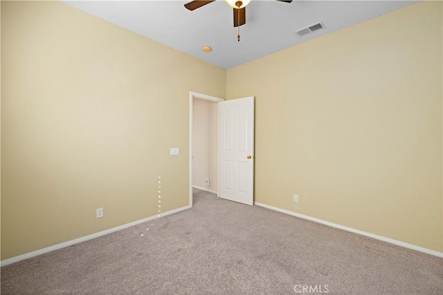 carpeted empty room featuring ceiling fan